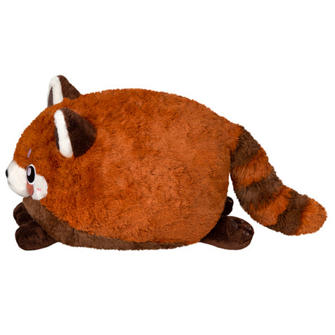 A side view of the plush red panda. Its body is very round.