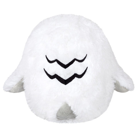 A back view of the plush snowy owl