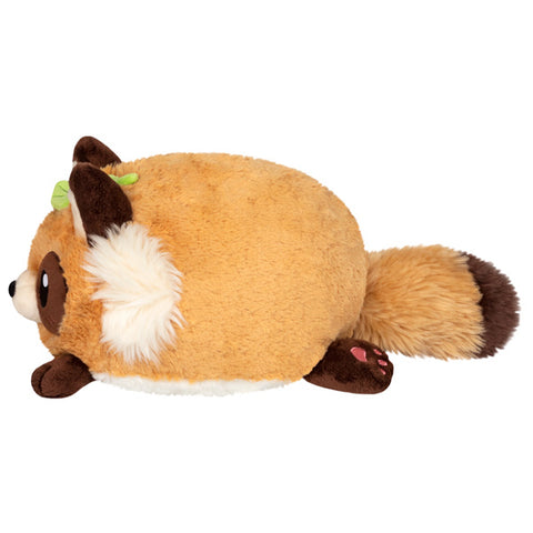 A side view of the plush tanuki