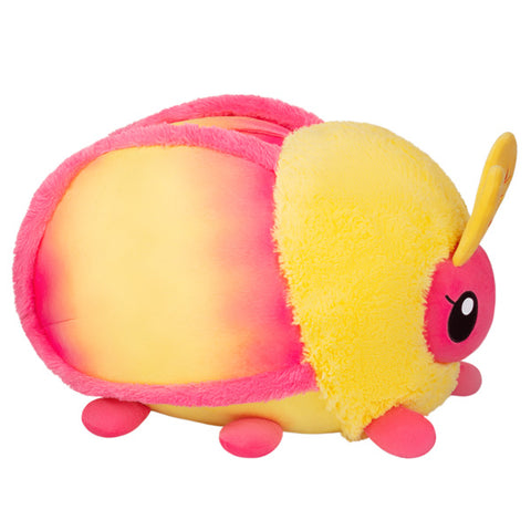 A side view of the plush Rosy Maple Moth
