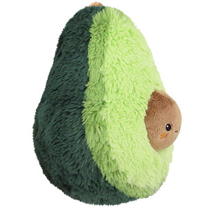 A side view of the plush avocado toy on a white background