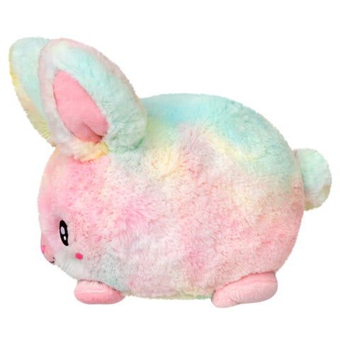 A side view of the plush tie-dye bunny