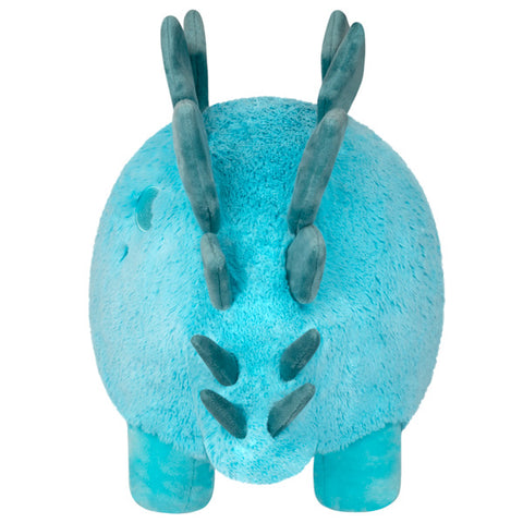 A back view of the plush Stegosaurus