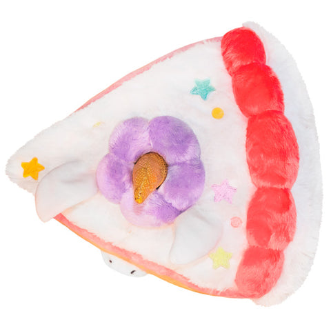 A top-down view of the unicorn cake on a white background