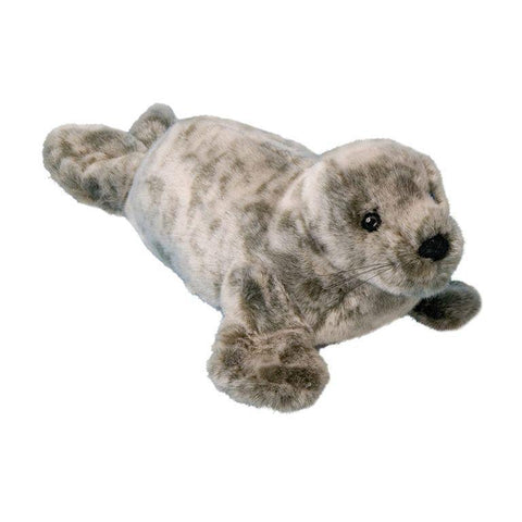 Image shows a stuffed seal. It is greyish-brown with speckles.
